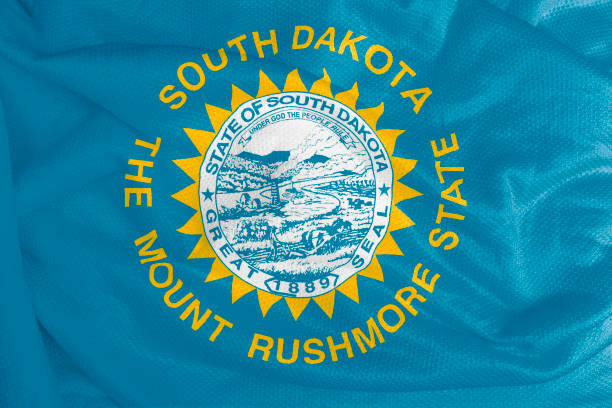 istock South Dakota flag waving from textured fabric 1292421115