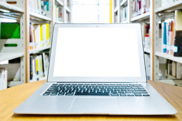 istock Blank laptop on the table of library 1292425475
