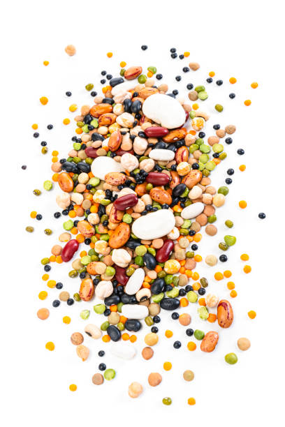 istock Mixed dried legumes heap isolated on white background 1292425613