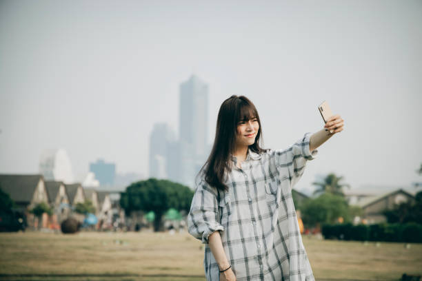 istock Asian woman smile take selfie 1292426068