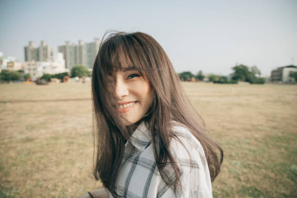 istock Asian Woman Smile To Camera 1292426158