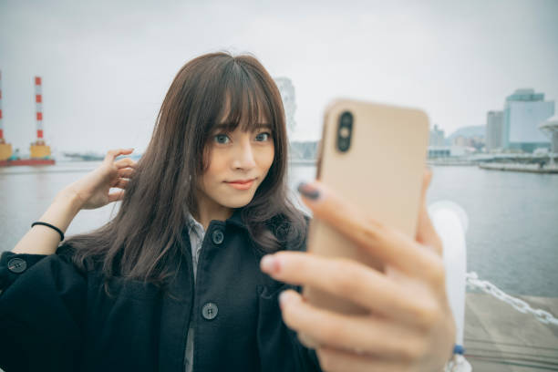 istock Asian woman smile take selfie 1292427044