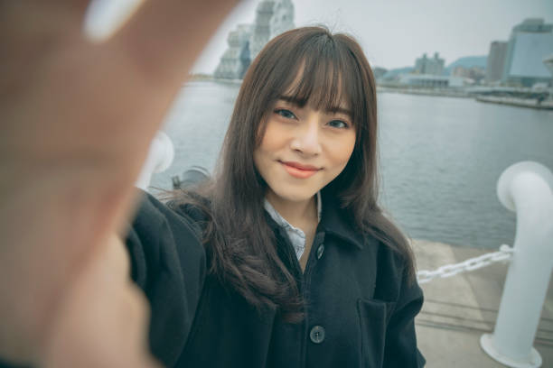 istock Asian woman smile take selfie 1292427119