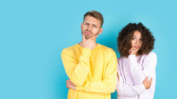 istock Mixed race friends standing on blue background 1292428325