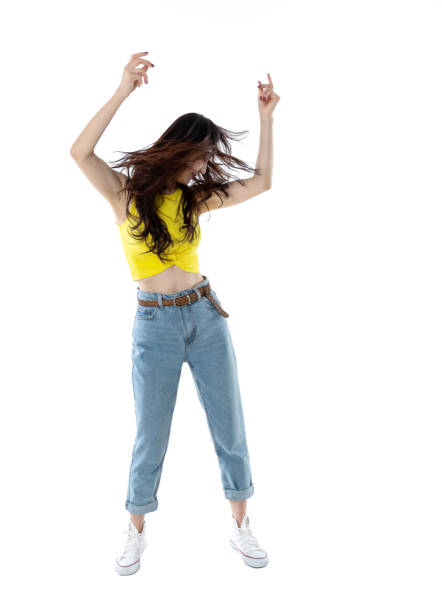 mujer extática bailando sobre fondo blanco - isolated on white full length lifestyles yellow fotografías e imágenes de stock