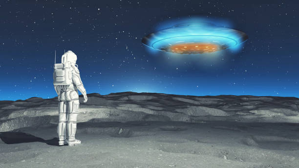istock Astronaut on the moon looking at an UFO . This is a 3d render illustration. 1292430082