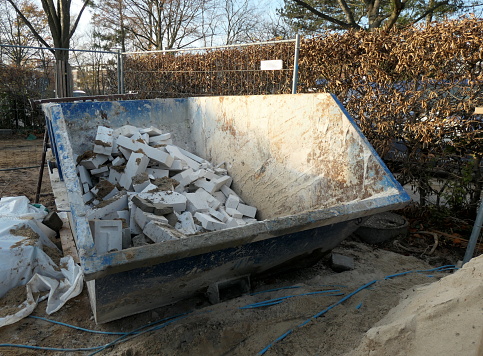Containers filled with rubble, ready for collection on the site of a construction site