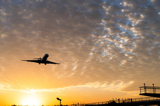 istock Airplane flying over radio antenna 1292432445