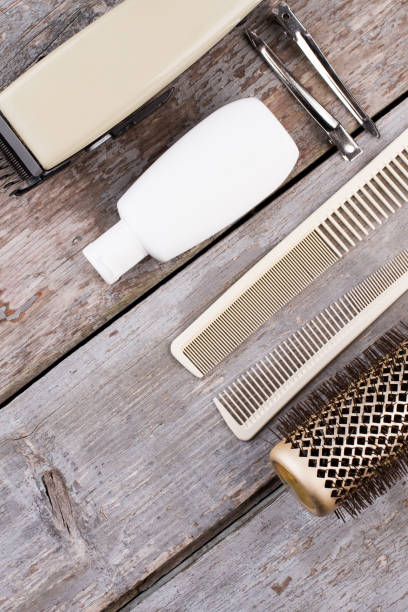 istock Vintage barber shop tools on rustic wooden background. 1292433129