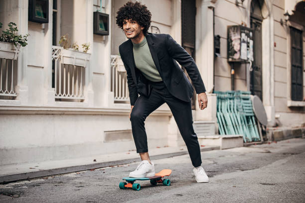 istock Happy businessman skateboarding to his workplace 1292433151