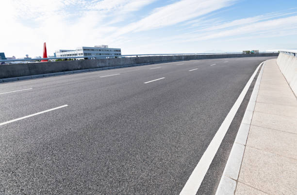 istock Empty uphill road in the city 1292433165