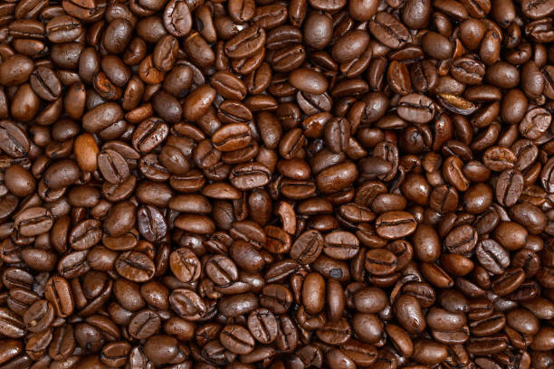 istock Background of roasted coffee beans from close up 1292433201