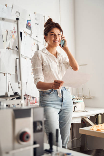 istock Woman standing with sketch in her hands 1292434640