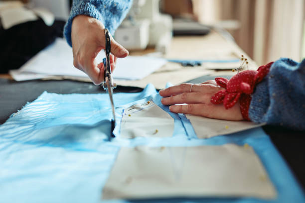 istock Cutting all the pieces required for her garment 1292435500