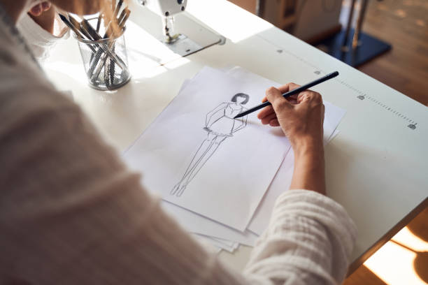 istock Couturier drawing sketches of clothing 1292435514