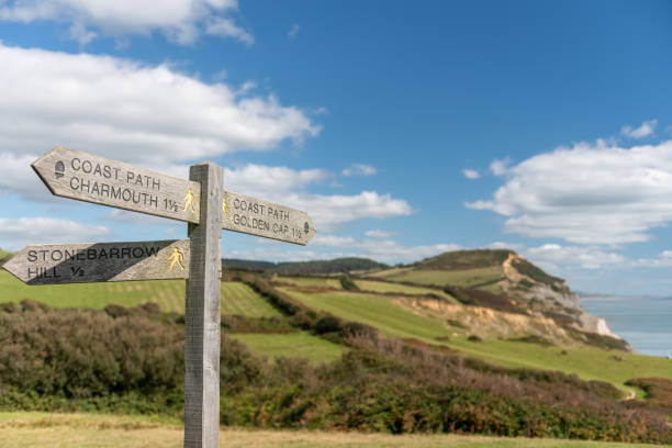 Golden Cap Mountain Close up of a footpath sign pointing to Golden Cap mountain on the Jurassic Coast in Dorset national trust photos stock pictures, royalty-free photos & images