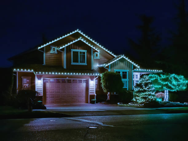 American suburban home exterior with festive Christmas lights stock photo