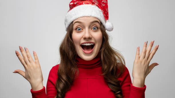istock Young girl with santa hat with joyful emotions 1292436029
