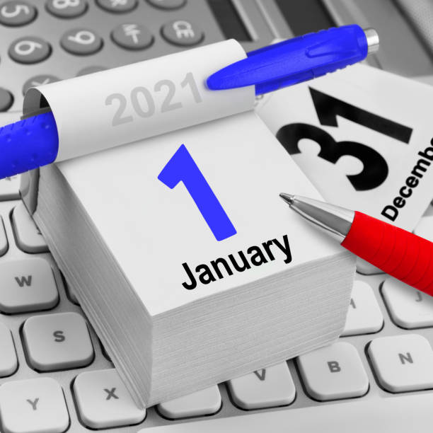 istock Calendar with red and blue pen and PC keyboard and calculator 1292436367