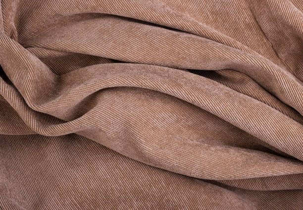 texture du textile torsadé de velours côtelé de crème pour l’arrière-plan - corduroy jacket photos et images de collection