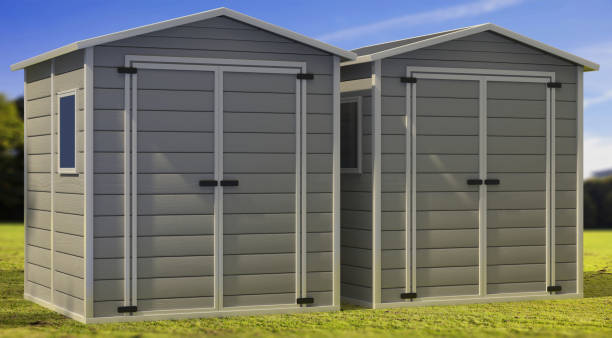 istock Storage sheds on green lawn and blue sky background. 3d illustration 1292441717