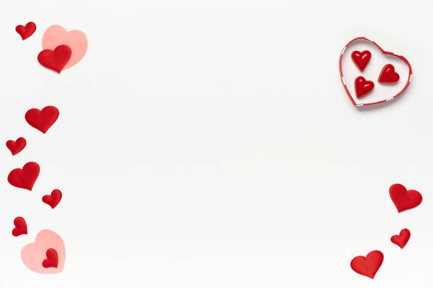 istock Saint Valentine concept, top view of colored hearts and candy inside gift box on white isolated with place for text background 1292442519