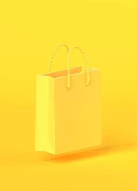 istock Empty yellow color shopping bag on the yellow background 1292443569