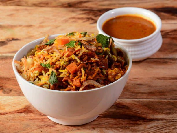istock Traditional hyderabadi Vegetable / veg biryani with mixed veggies served with curry, selective focus 1292444093