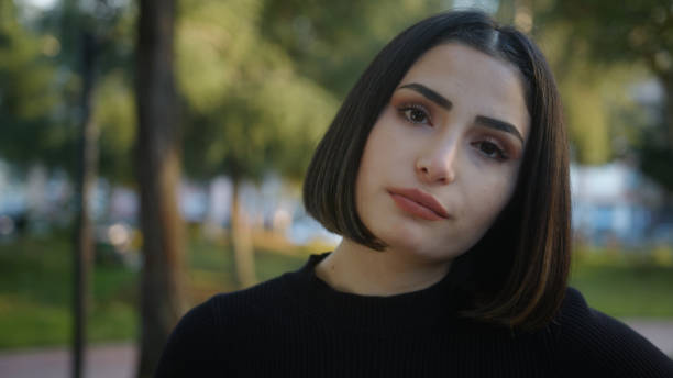 istock Young attractive woman taking a bored demeanor looking at the camera 1292444849