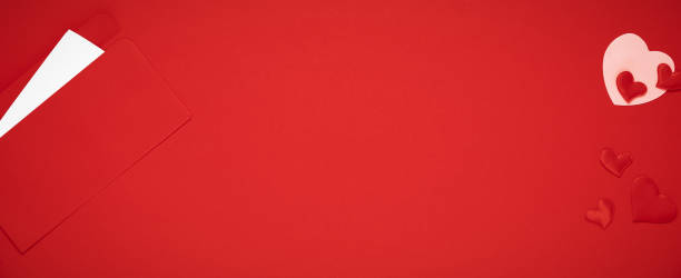 istock Valentine day template. Red envelope with letter and hearts on red background 1292449980