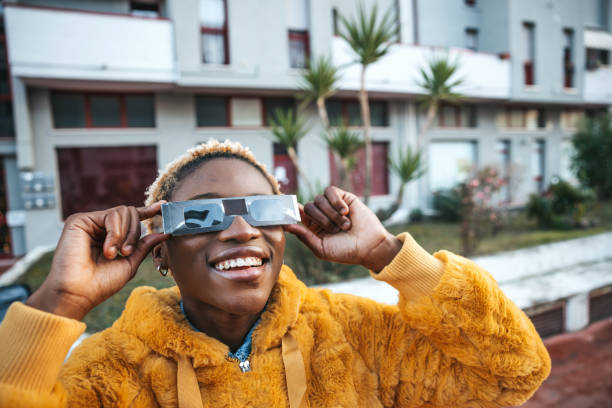 istock Teenage girl looking at solar eclipse 1292454222