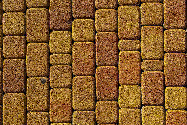 istock background stone pavement. road paved with cobbles. texture of bricks. 1292454358