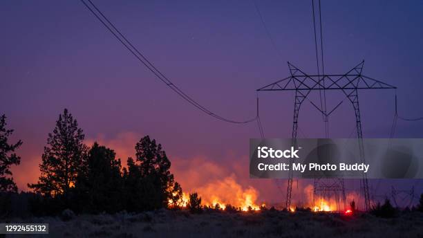 Wildfire Under Electrical Transmission Line Stock Photo - Download Image Now - Forest Fire, Power Line, Power Cable