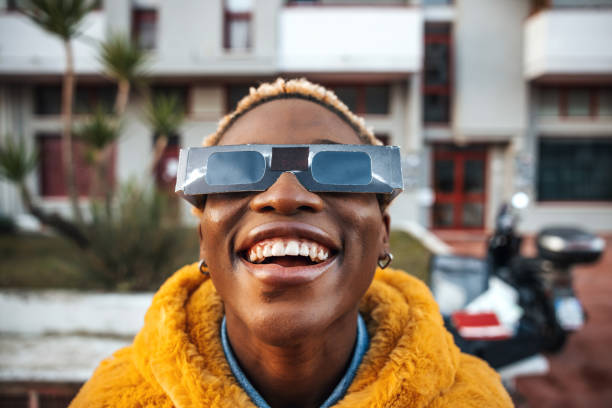 Teenage girl looking at solar eclipse