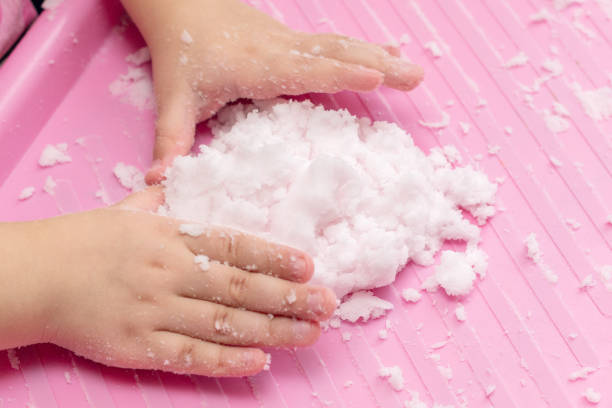 istock Child plays with artificial snow for home decoration 1292458028