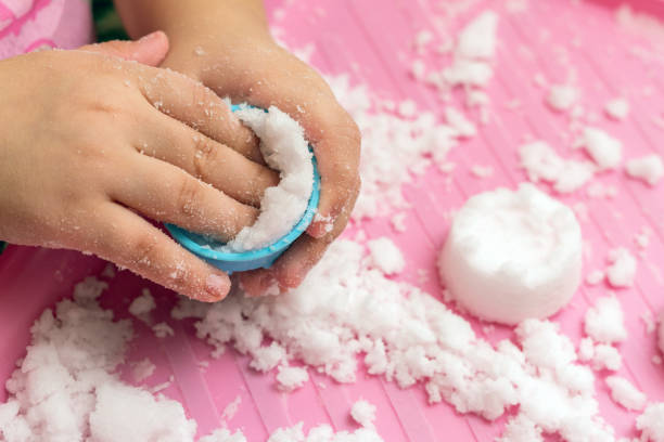 istock Child plays with artificial snow for home decoration 1292458029
