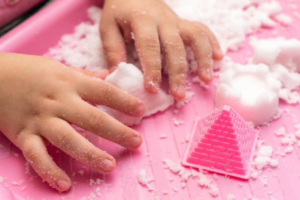 istock Child plays with artificial snow for home decoration 1292458054