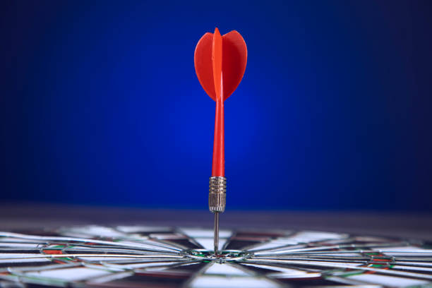 istock Darts arrows in the target center 1292458820
