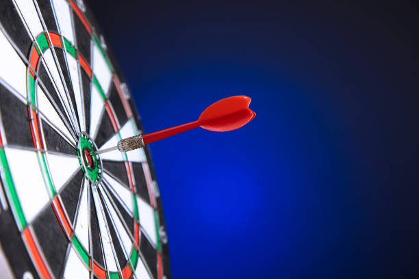 istock Darts arrows in the target center 1292458827