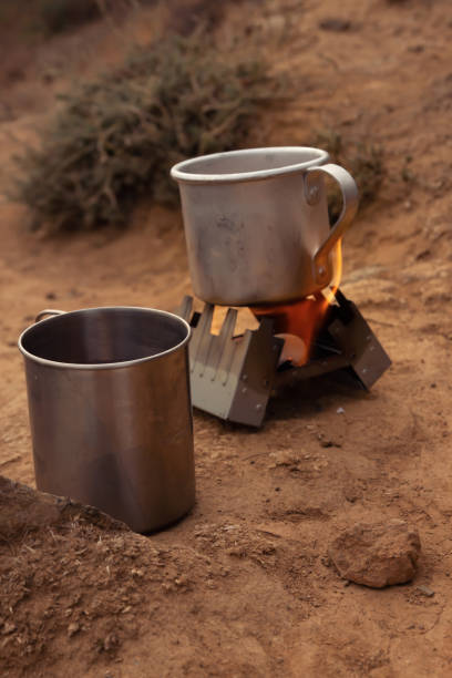 istock Iron, tourist mugs on an open fire during a camping trip 1292469954