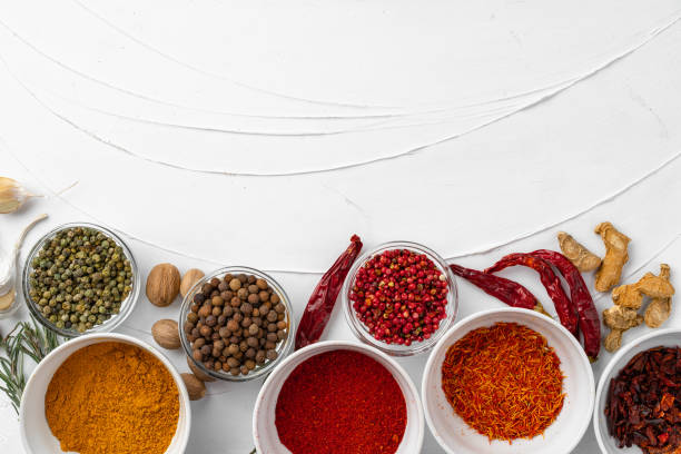 istock Top view of different spices on white textured background 1292470840