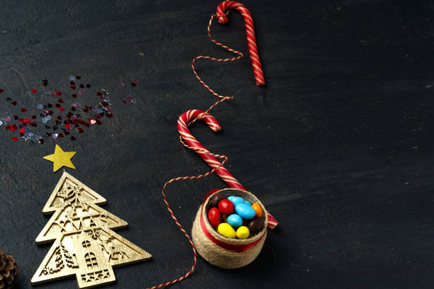 istock Decorative Christmas tree on black wooden board 1292472007