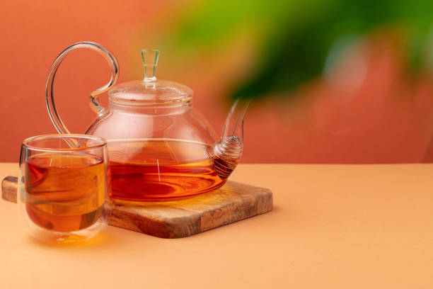 istock Glass teapot and cup with black tea 1292474112