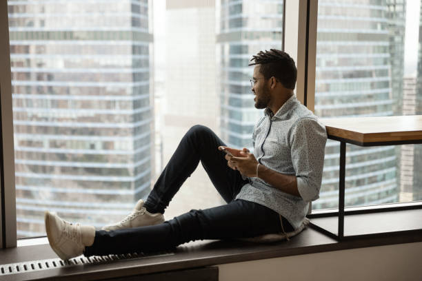 istock African American man relax on windowsill dreaming 1292475529