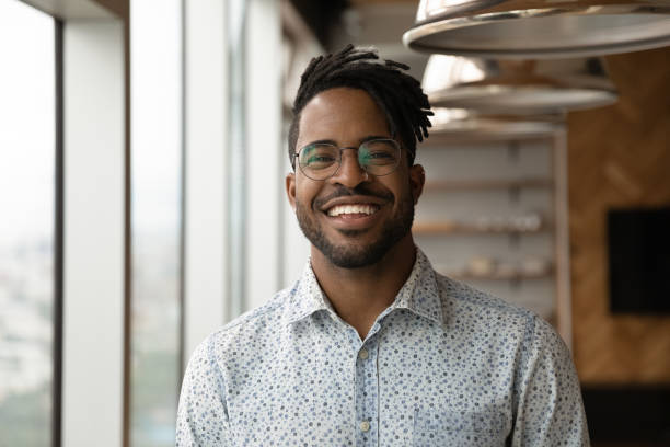 headshot portrait of smiling biracial man posing - looking in camera imagens e fotografias de stock