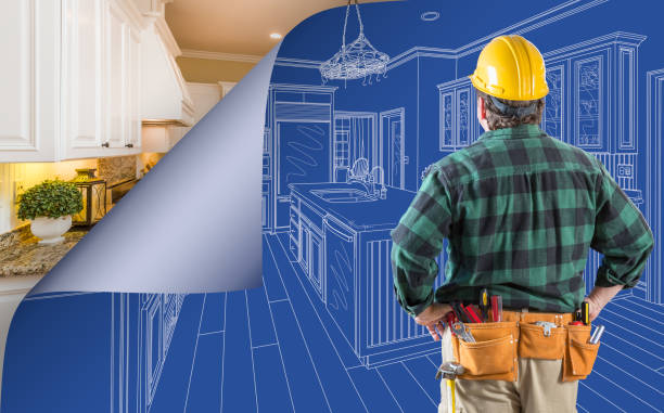 istock Contractor Standing In Front Custom Kitchen Blueprint Drawing With Page Corner Curling To Reveal Finished Construction 1292475777
