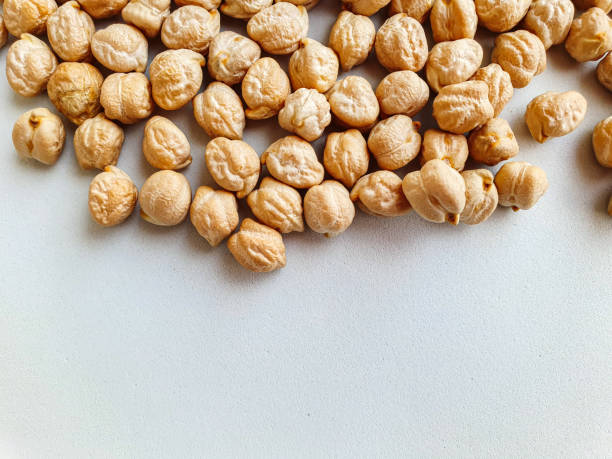 Uncooked dried chickpeas. Top view. Food background. Heap of legume chickpeas background