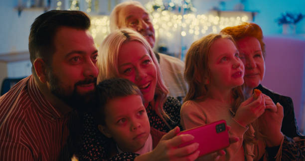 istock Excited family watching New Year fireworks in window 1292478251