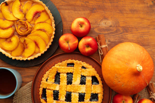 istock Thanksgiving berry and apple various pies on wooden surface, top view 1292478590
