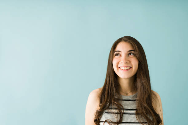 istock Positive young woman is thinking and remembering good times 1292485456
